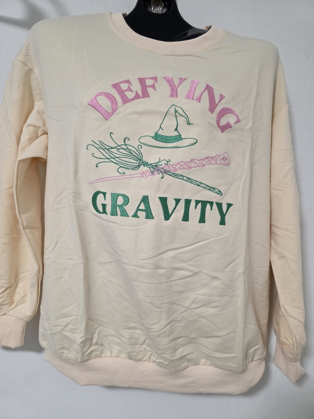 Wicked Defying Gravity Crewneck Sweatshirt - Cream with Pink & Green